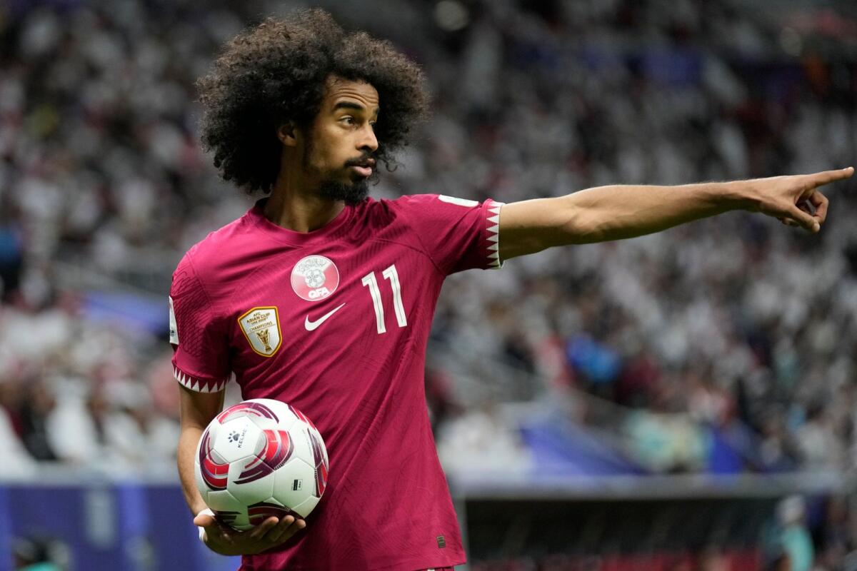 Qatar's Akram Afif gestures during the match against Tajikistan. — AP