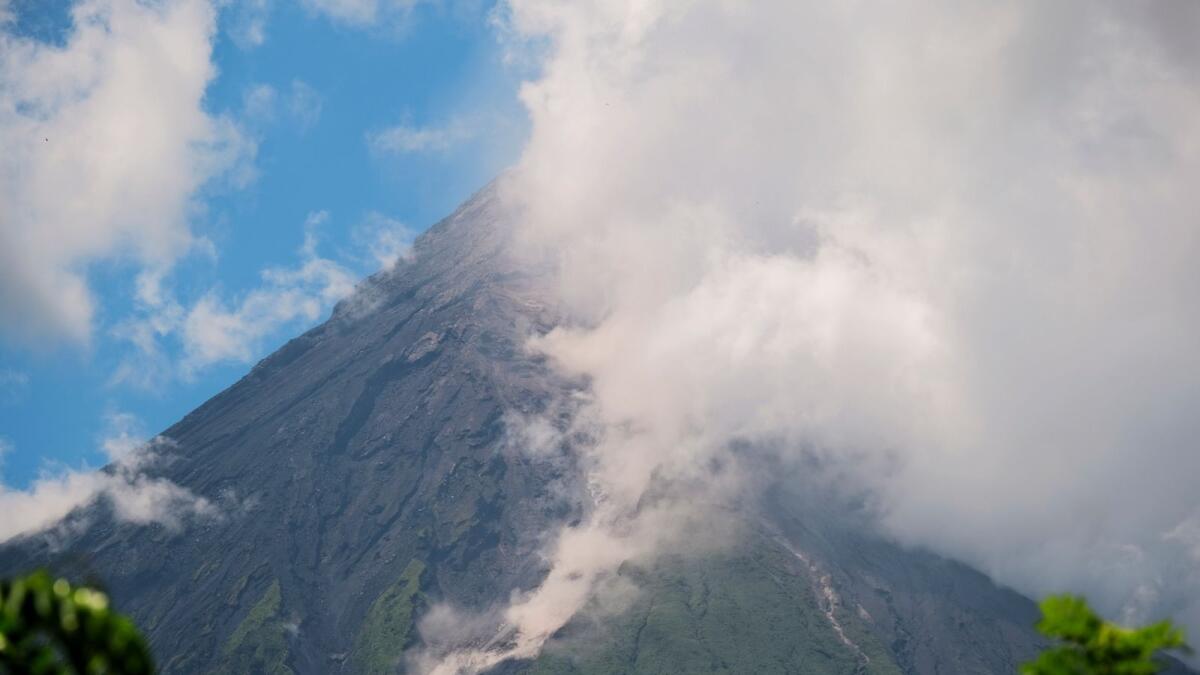 Mayon Volcano spews white smoke as seen from Daraga, Albay province, central Philippines on Thursday . — AP