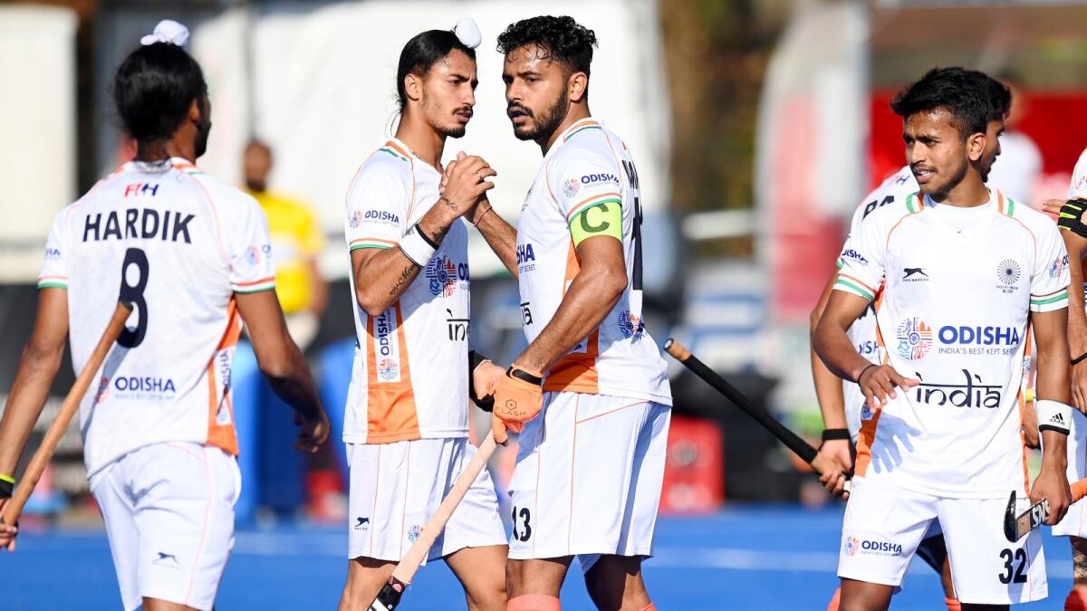 The Indian players celebrate a goal during a practice match.