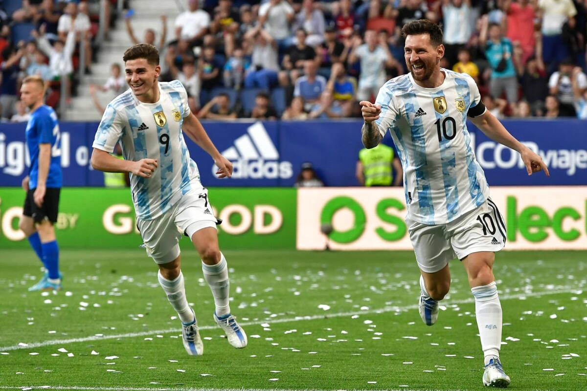 Lionel Messi celebrates scoring his side's third goal during the match against Estonia. (AP)