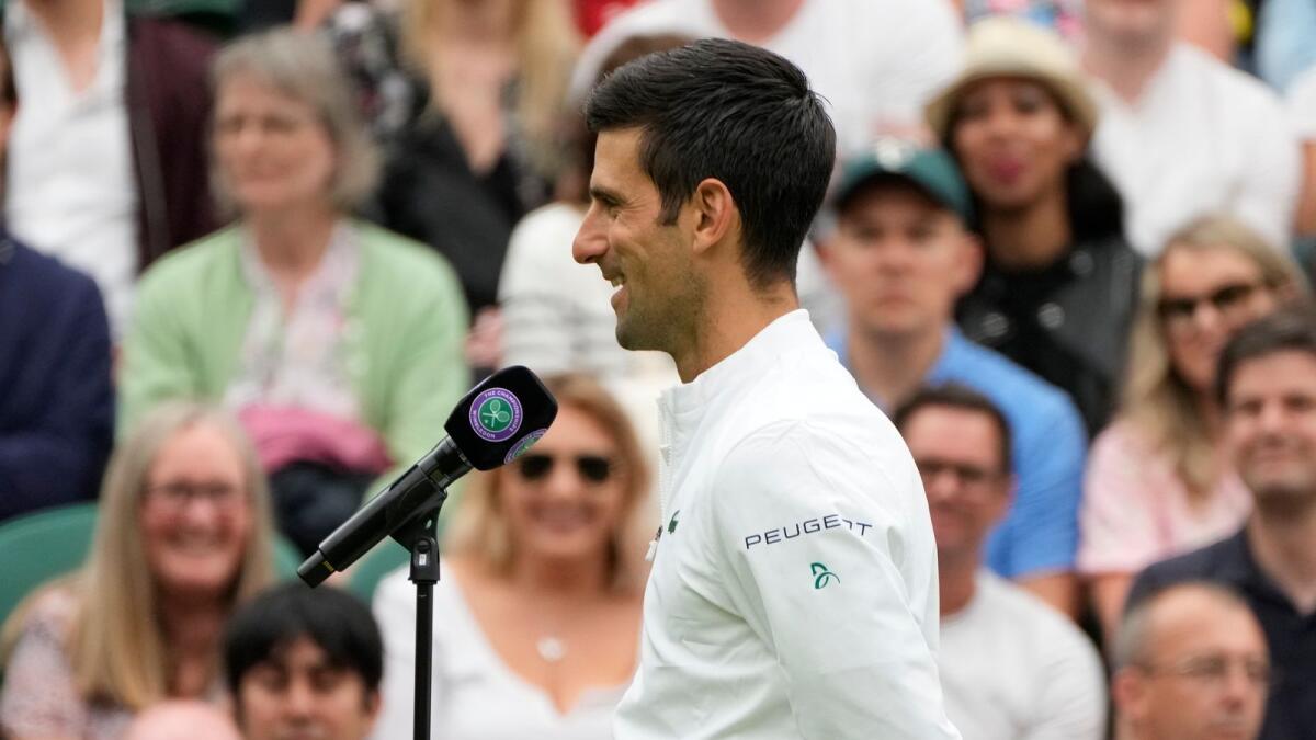 Serbia's Novak Djokovic gives an interview on Centre Court after defeating Britain's Jack Draper. — AP