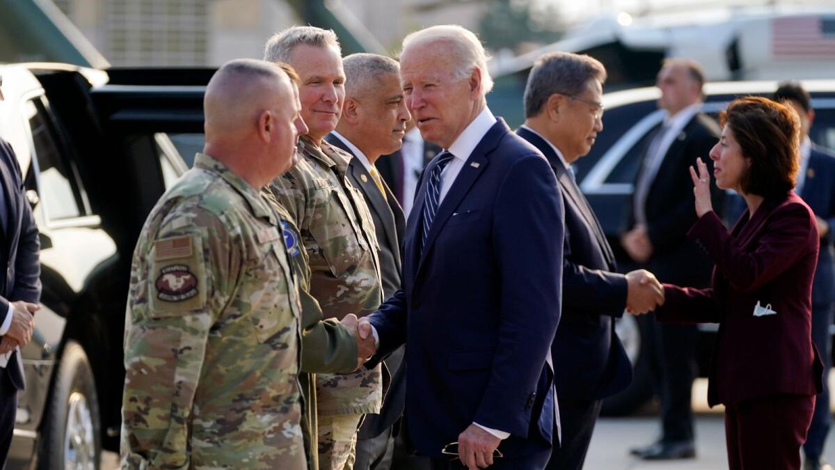 US military personel greet President Joe Biden as he arrives in Pyeongtaek, South Korea. – AP