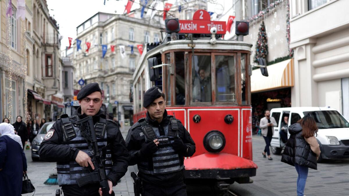 Turkish riot police patrol outside the Swedish consulate In Istanbul, Turkey, on Tuesday. — Reuters