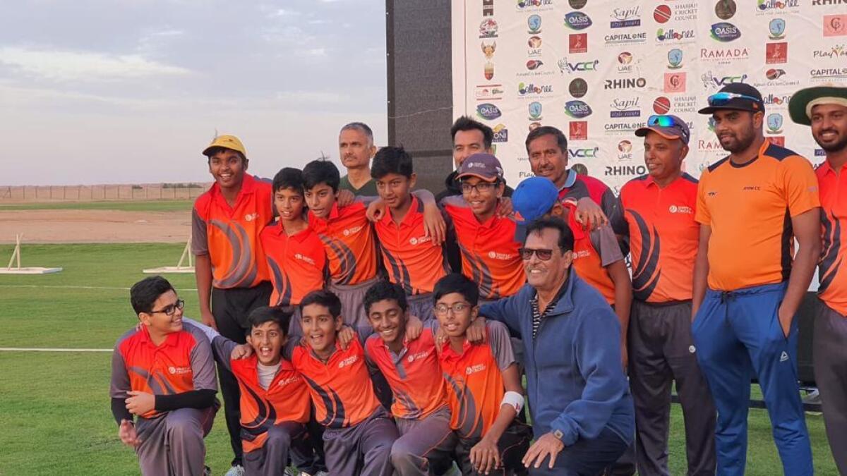 Roop Razdan (front row, right) with his Simply Cricket Academy trainees and coaches. - Supplied photo