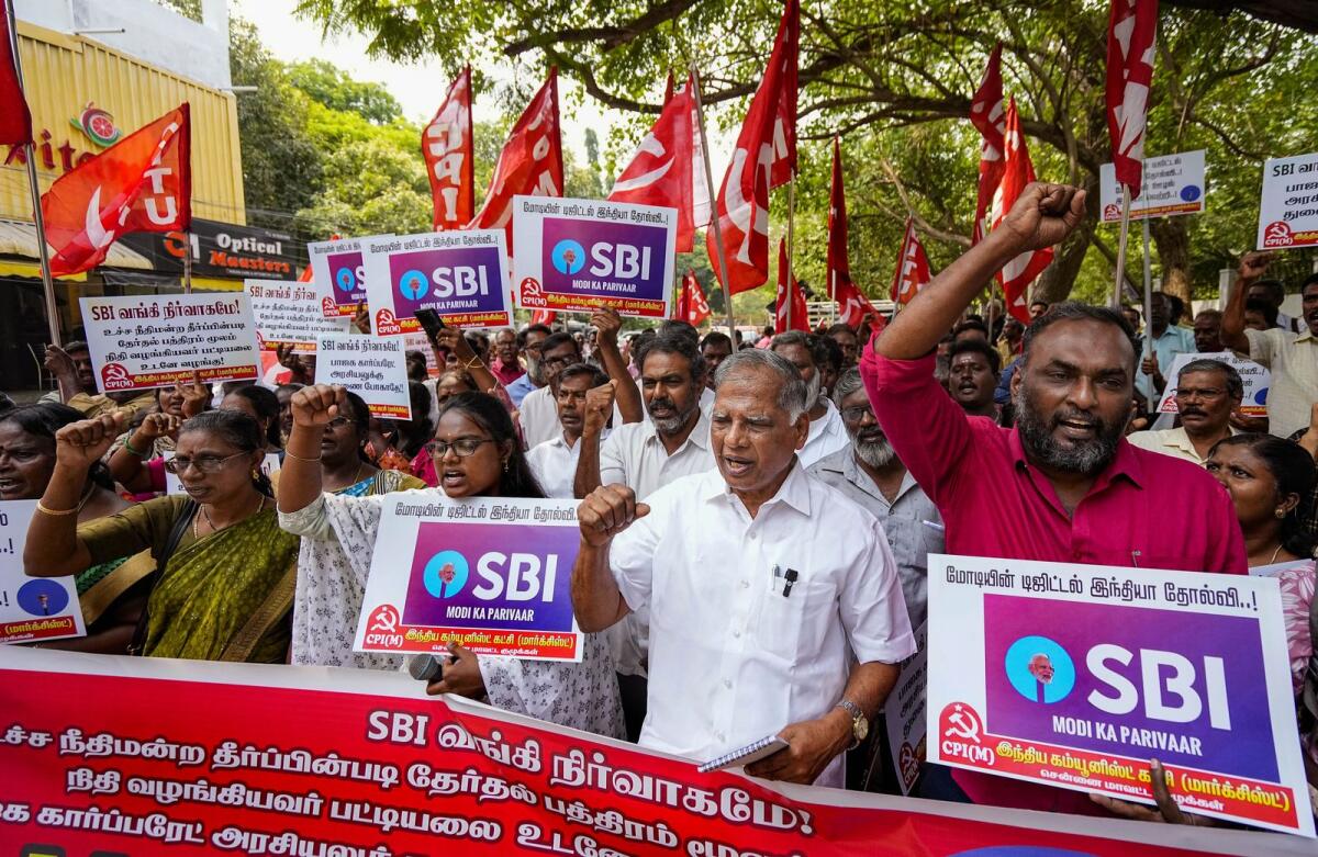 CPI(M) workers stage a protest against the State Bank of India (SBI) moving the Supreme Court to seek more time to disclose electoral bond details. Photo: PTI