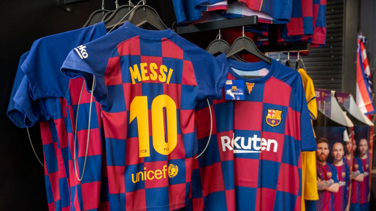 Lionel Messi shirts are displayed in a souvenir store in downtown Madrid. — AP