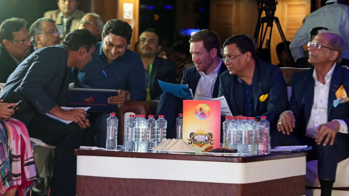 Eoin Morgan, Robin Singh and the other members of the Kerala Kings team during the players' draft for the first ever T10 Cricket League on the Lotus yacht at Dubai Marina