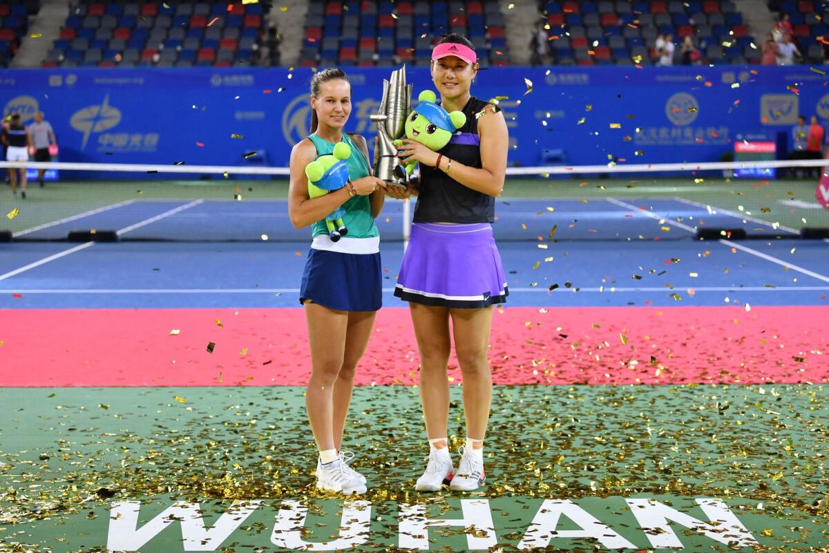Duan Yingying (right) of China and Veronika Kudermetova of Russia pose with the trophy after winning the doubles title at the 2019 Wuhan Open. — AFP file