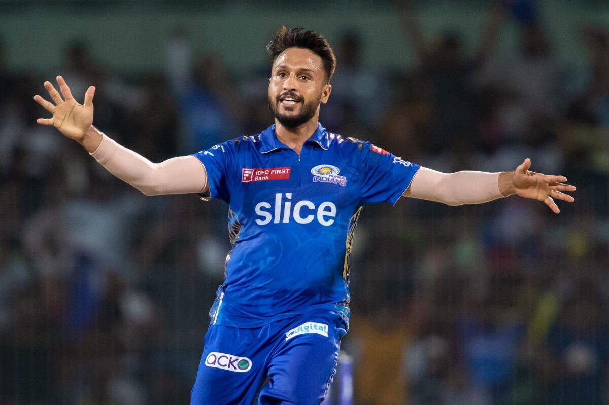 Mumbai Indians' Akash Madhwal celebrates the wicket of Lucknow Super Giants' Krishnappa Gowtham. — AFP