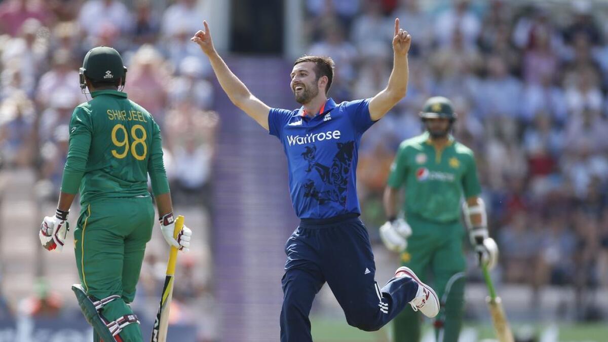 Englands Mark Wood celebrates taking the wicket of Pakistans Sharjeel Khan