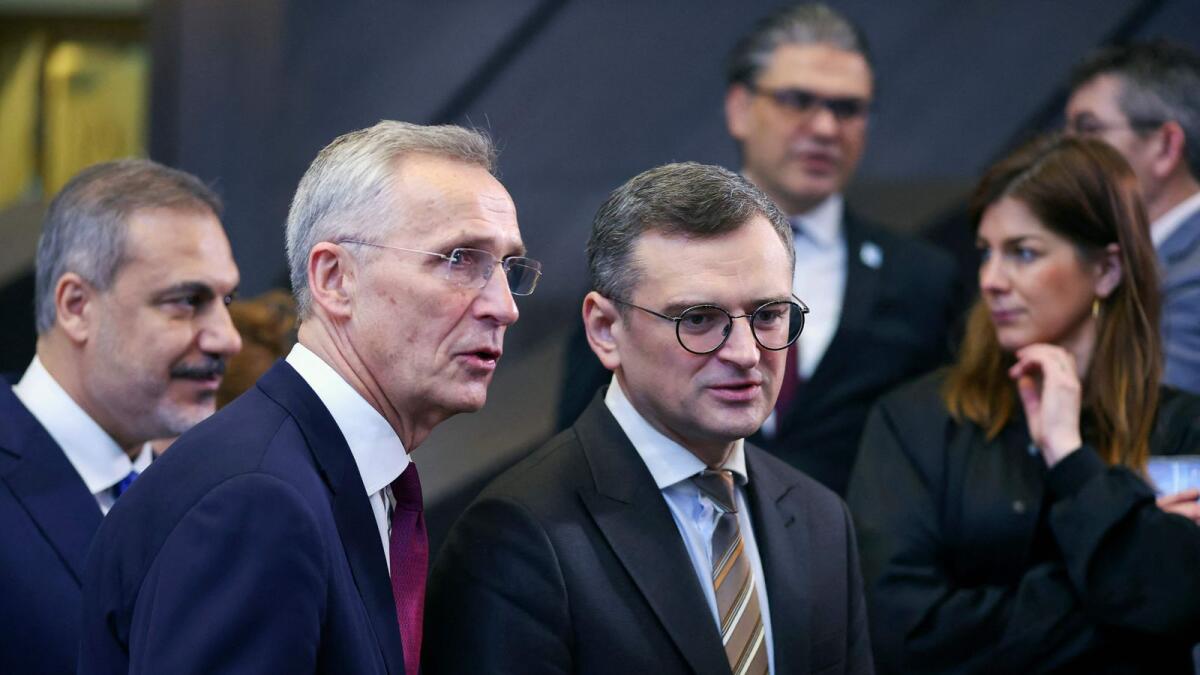 Ukraine's Foreign Minister Dmytro Kuleba and NATO Secretary General Jens Stoltenberg take part in a meeting of the NATO-Ukraine Council in the Foreign Ministers' session at the Alliance's headquarters in Brussels on Thursday. — AFP