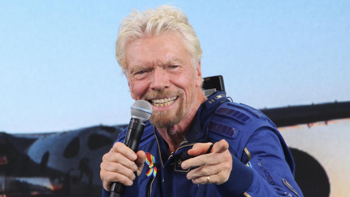 Virgin Galactic founder Richard Branson answers students' questions during a news conference at Spaceport America. — AP