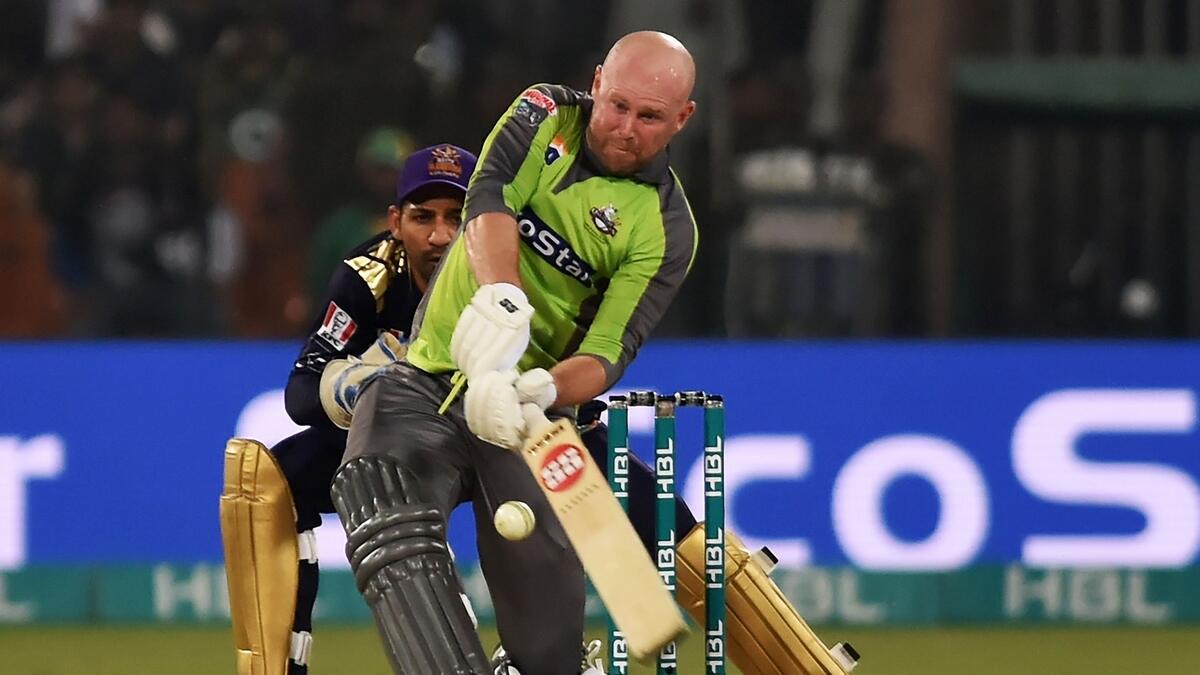 Ben Dunk of the Lahore Qalandars hoists one over the fence against the Quetta Gladiators - AFP