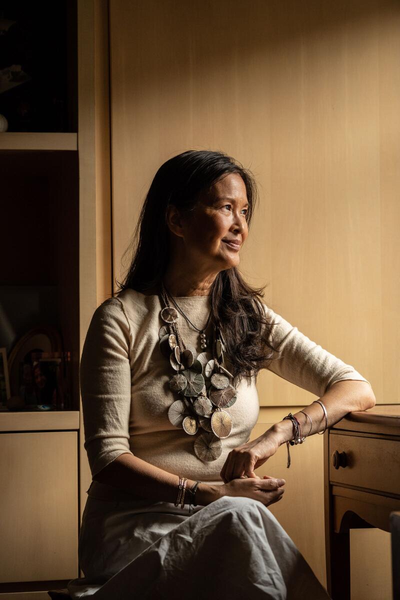 Suzy Nguyen, a divorced writer, at her home on the Upper East Side in New York on May 9, 2023.  (Ava Pellor/The New York Times).