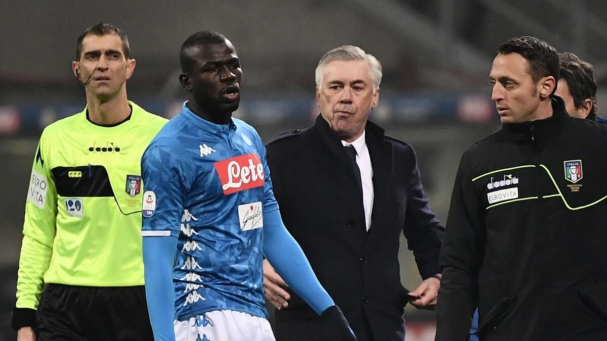 Napoli fans don masks to support Koulibaly