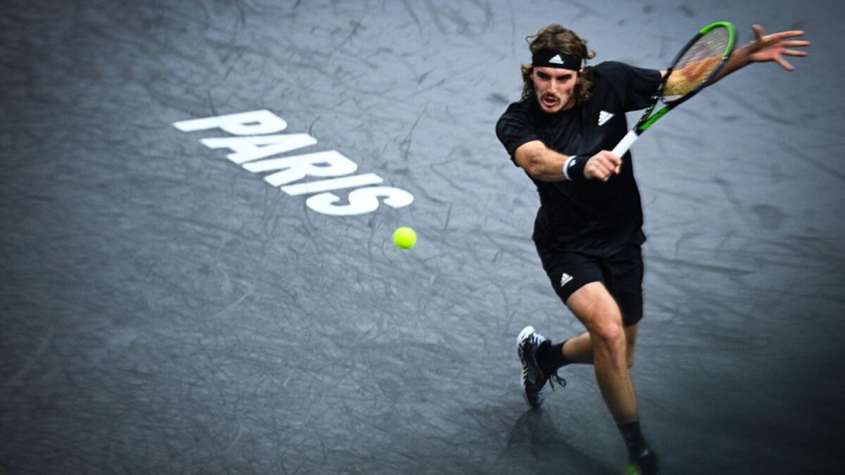 Stefanos Tsitsipas returns the ball to Ugo Humbert during the second round match at the Paris Masters. — AFP