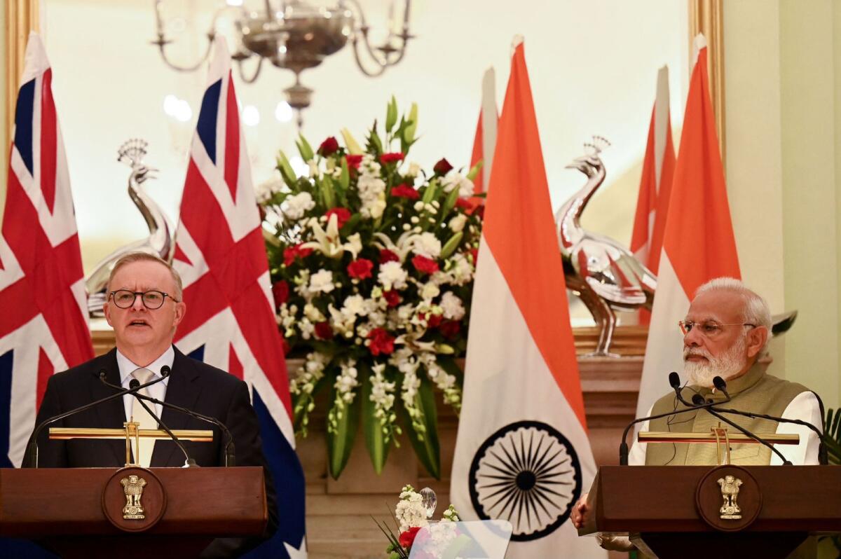 Indian Prime Minister Narendra Modi looks on as Australia's Prime Minister Anthony Albanese speaks during a joint media briefing at Hyderabad House in New Delhi on Friday. — AFP