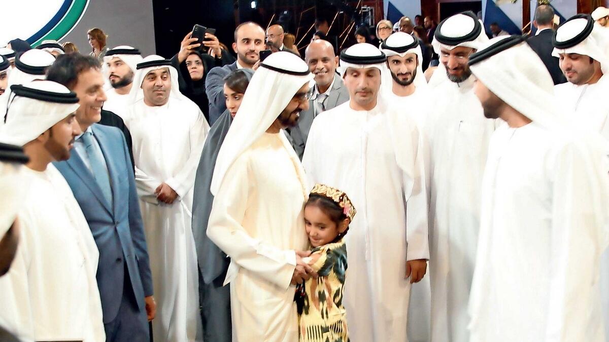 Mahina hugs Sheikh Mohammed at the MBRGI report launch.  — Photo by Juidin Bernarrd
