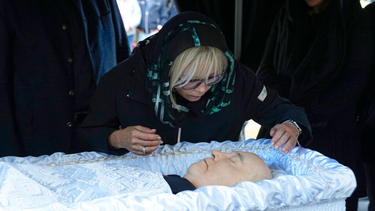 Irina Virganskaya, daughter of former Soviet Union President Mikhail Gorbachev says goodbye to her father for the last time, during his funeral, at Novodevichy Cemetery in Moscow, Russia, on Saturday. – AP
