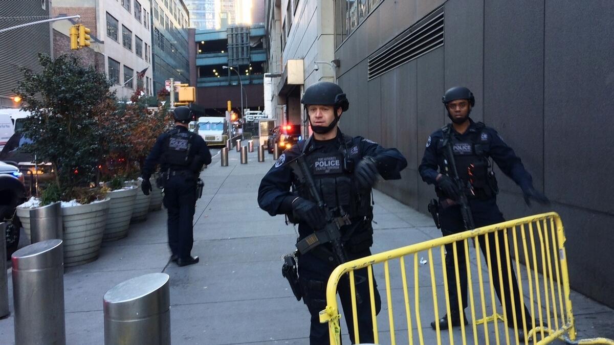 Police block off a sidewalk while responding to a report of an explosion near Times Square in New York.-AP 