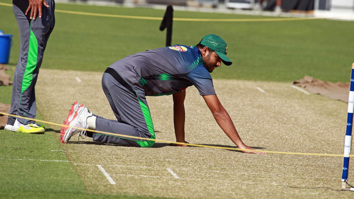 Azhar Ali inspects the pitch ahead of the fourth one-dayer against England in Dubai. — Photo by Shihab