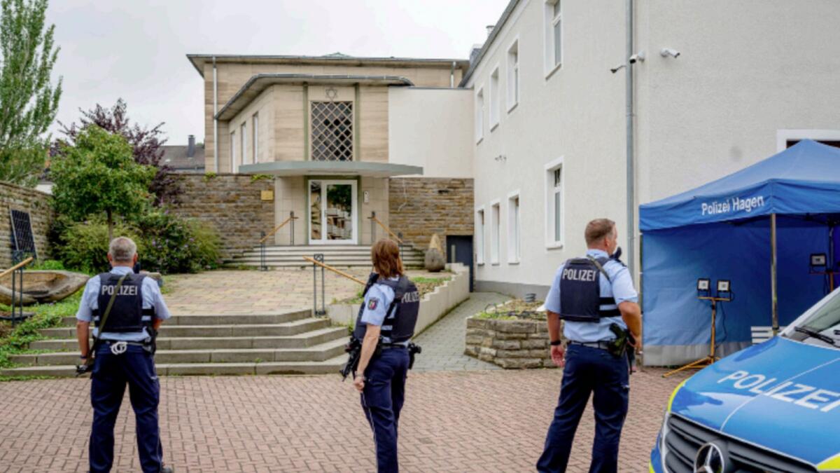 Police officers stay in front of the entrance to the Jewish Community building in Hagen. — AP