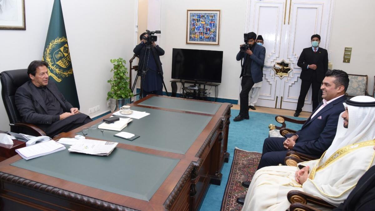 Pakistan Prime Minister Imran Khan welcomes Sheikh Ahmed Dalmook Al Maktoum and Fakhr Alam in Islamabad. -- Supplied photo