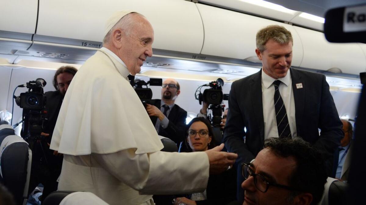 Pope Francis arrives on Greek island to meet with refugees