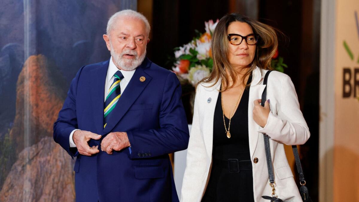 Brazilian President Luiz Inacio Lula da Silva, accompanied by First Lady Rosangela da Silva, arrive at the 2023 Brics Summit at the Sandton Convention Centre in Johannesburg on Wednesday. — Reuters