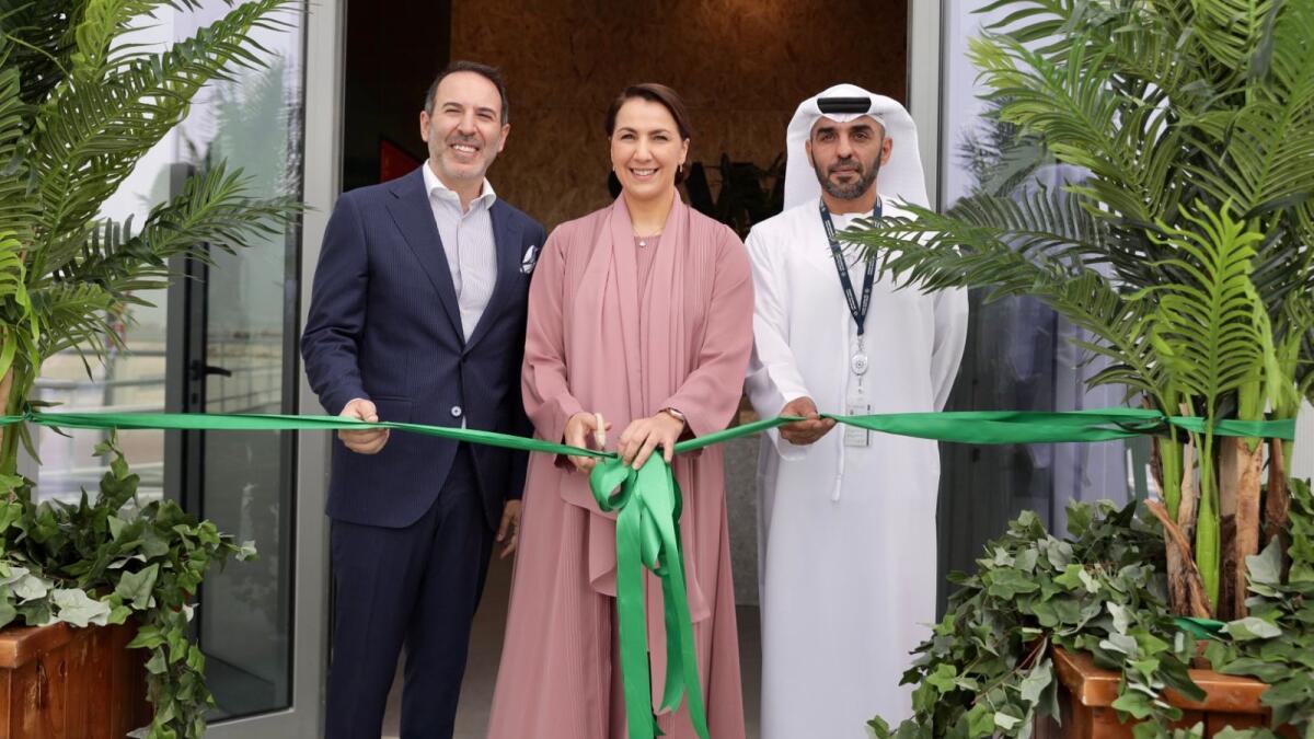 Mariam bint Mohammed AlMheiri, Minister of Climate Change and Environment, cuts the tape to inaugurate the Switch Foods facility in Abu Dhabi's Kezad, along with Abdullah Al Hameli, CEO, Economic Cities and Free Zones, AD Ports Group (right), and Edward Hamod, founder and CEO of Switch Foods.  — Supplied photos