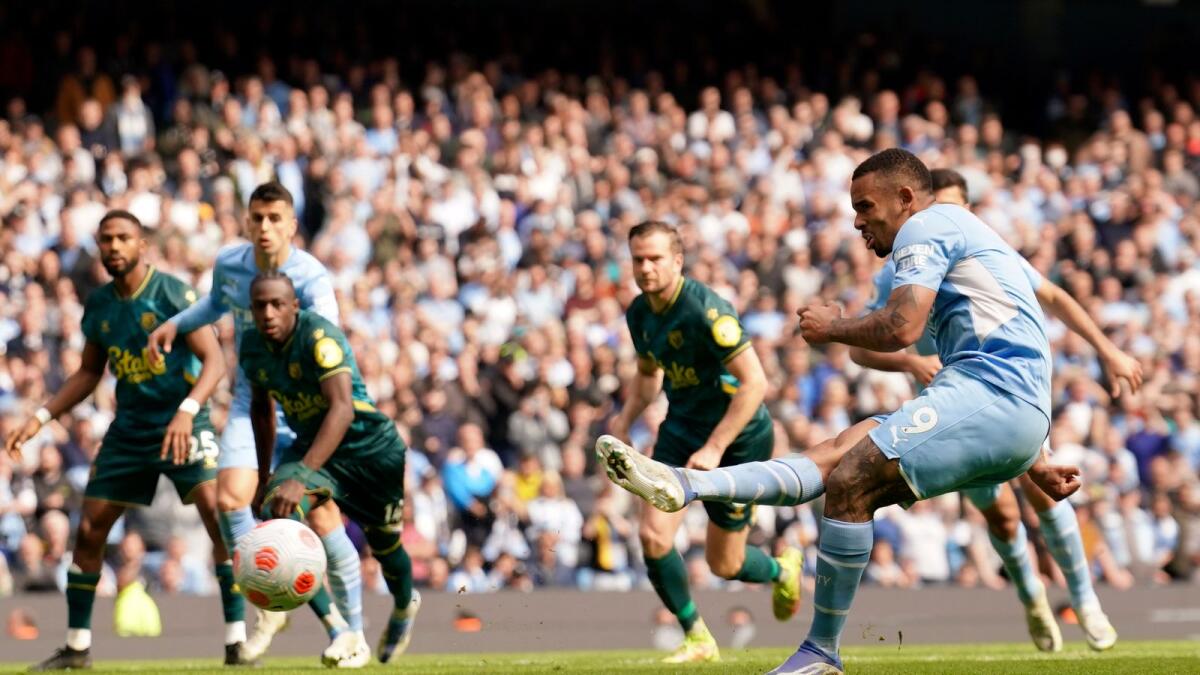 Manchester City's Gabriel Jesus scores his side’s fourth goal from the penalty spot during the Premier League match against Watford. (AP)
