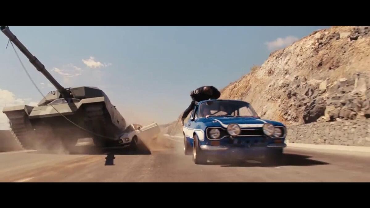 5) They got a tank! (Fast and Furious 6 - 2013).  “They got a tank,” says Tej Parker, and that is when we know a spectacular scene is on the cards. It gets better and better with Roman’s ongoing commentary with a tank behind him. This scene was equivalent to the GTA life, in which driving tanks and obliterating literally anything that comes in the way is not unusual.