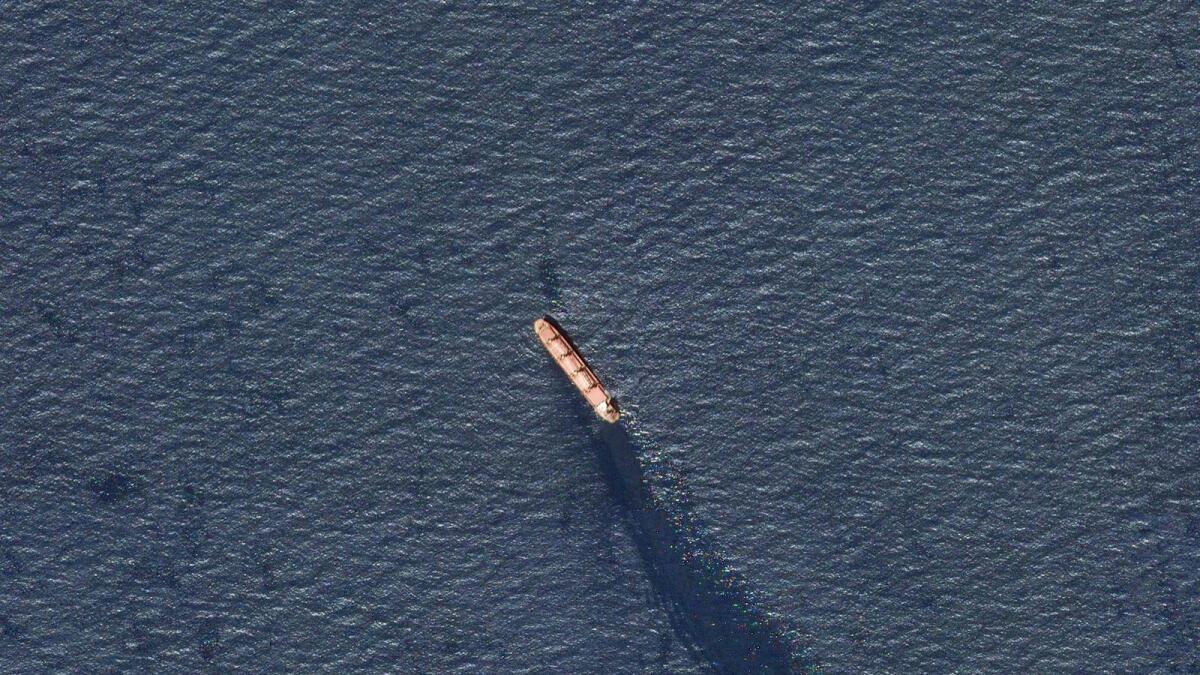 In this satellite image provided by Planet Labs, the Belize-flagged bulk carrier Rubymar is seen in the southern Red Sea near the Bay Al Mandab Strait leaking oil after an attack by Houthi rebels. — AP