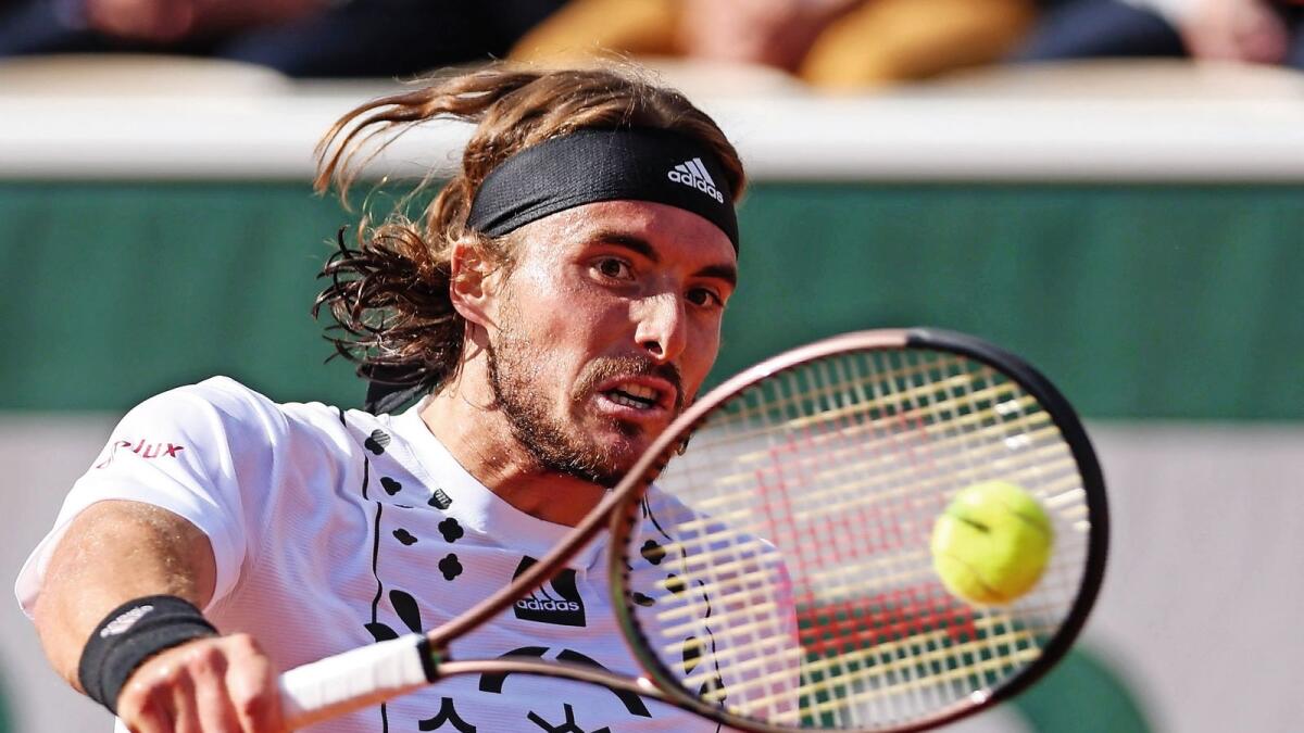 Greece's Stefanos Tsitsipas returns aaginst Mikael Ymer in the French Open on Saturday. — AFP