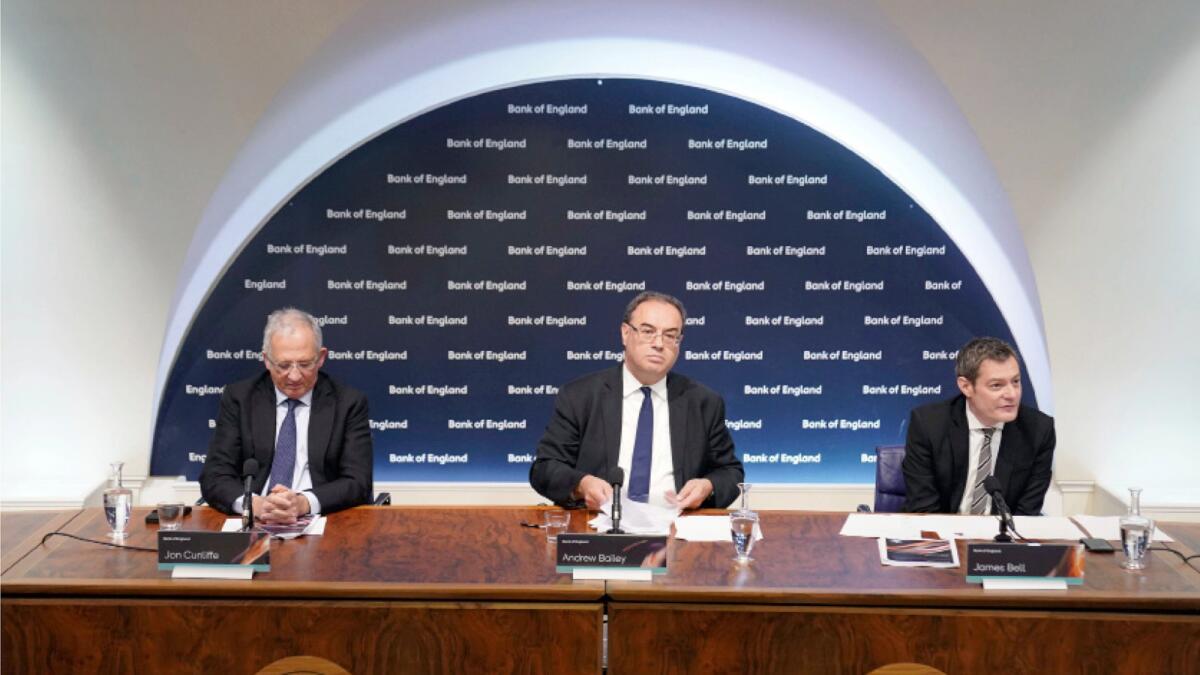 Jon Cunliffe, Deputy Governor for Financial Stability, Andrew Bailey, Governor of the Bank of England, and James Bell, Executive Director for Communications at Bank of England's financial stability report press conference in London. - AP