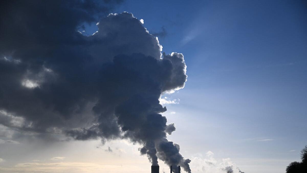 Huge clouds of steam come out of the chimneys of coal power plant in Niederaussem, western Germany. — AFP file