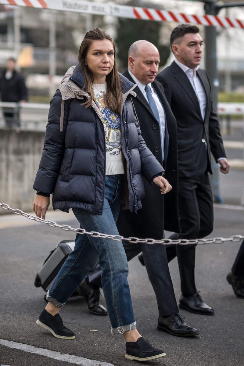 Former world number one tennis player Romania's Simona Halep (L) and her lawyer Howard Jacobs (C) arrive at the Court of Arbitration for Sport in Lausanne on February 7. - AFP