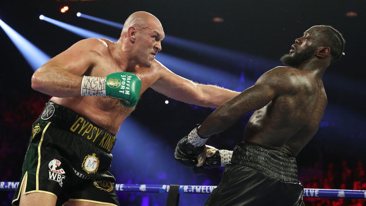 Tyson Fury punches Deontay Wilder during their heavyweight bout on February 22, 2020, at MGM Grand Garden Arena in Las Vegas, Nevada. (AFP file)