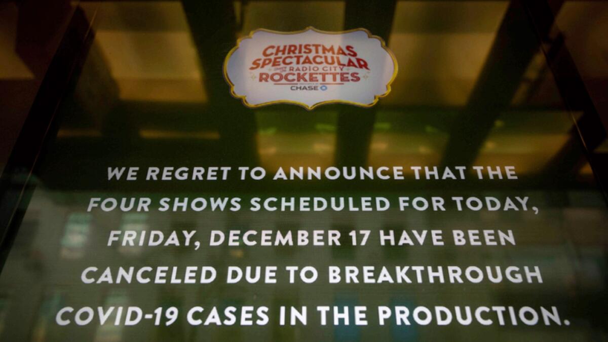 A screen shows the cancellations of The Rockettes performance due to Covid-19 cases on Friday in New York. — AP