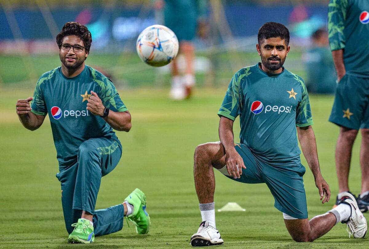 Imam-ul-Haq and Pakistan captain Babar Azam during a practice session in Bengaluru on Thursday. — PTI