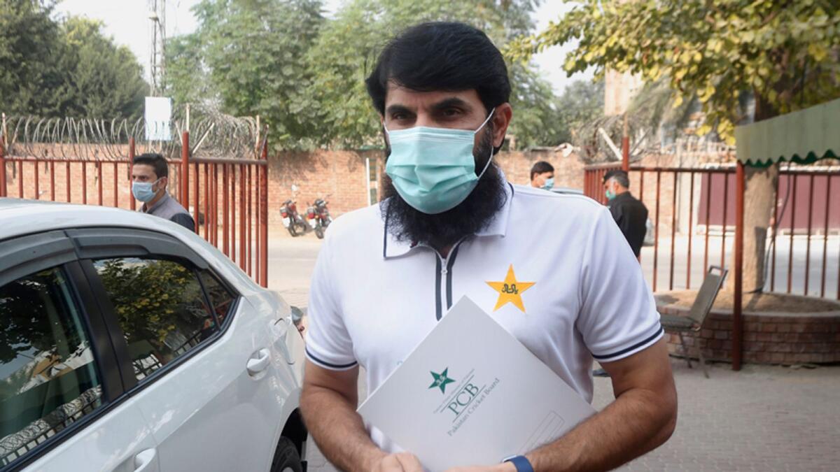 PCB chief selector Misbah-ul-Haq arrives for a press conference to announce the team members for next month's series against New Zealand, in Lahore on Wednesday. — AP
