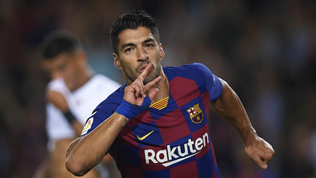 Barcelona's Luis Suarez expressed his delight at seeing his former club win the Premier League.
