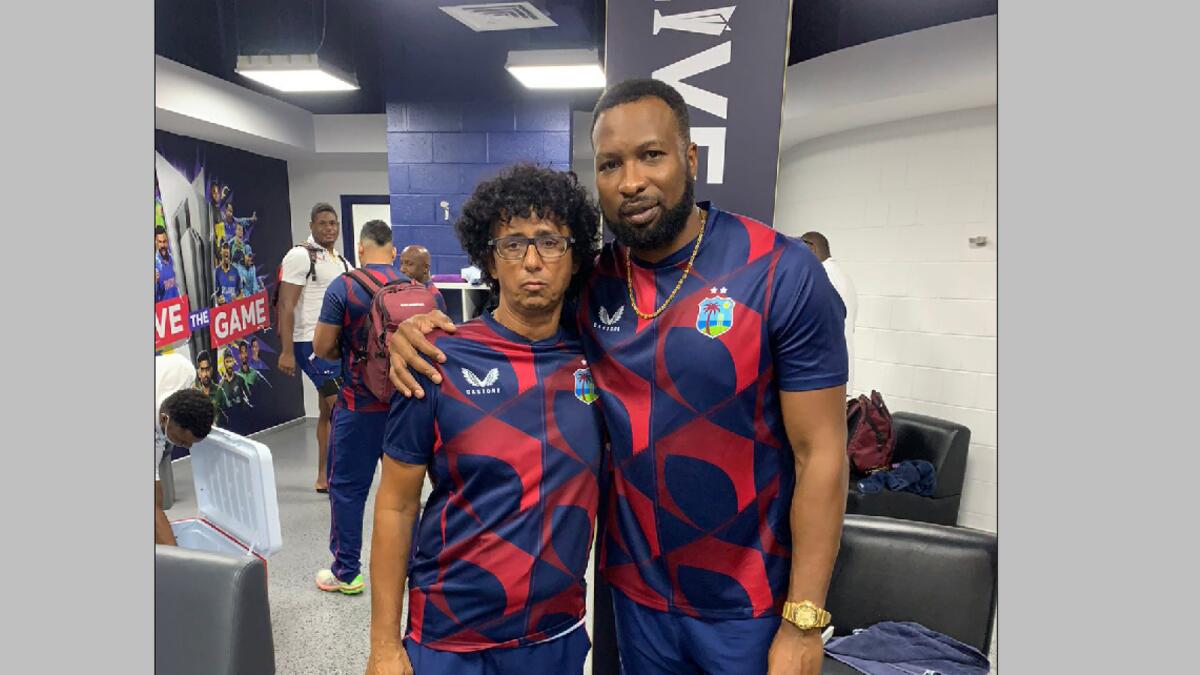 Gopal Jasapara with Kieron Pollard in the West Indies dressing room during the T20 World Cup. (Supplied photos)