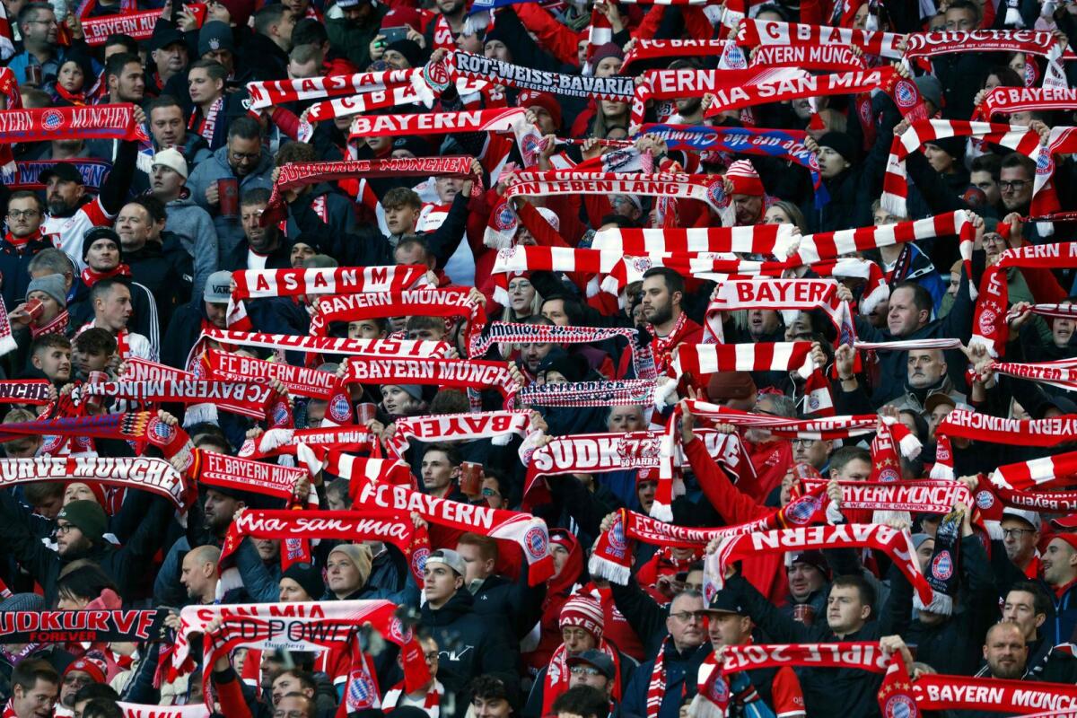Bayern Munich fans display their scarves. — AFP