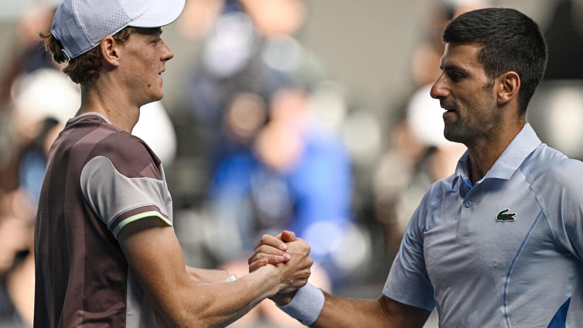 Italy's Jannik Sinner greets Serbia's Novak Djokovic (right). Photo: AFP