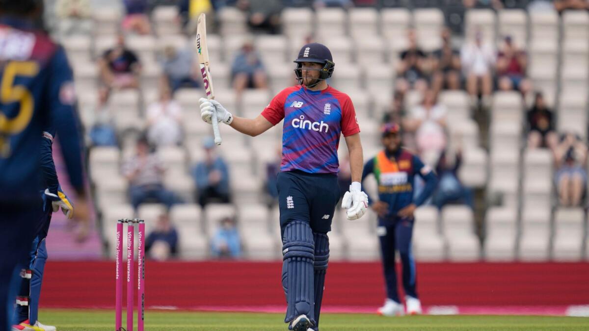 England's Dawid Malan celebrates his half-century during the third T20 International against Sri Lanka. (AP)