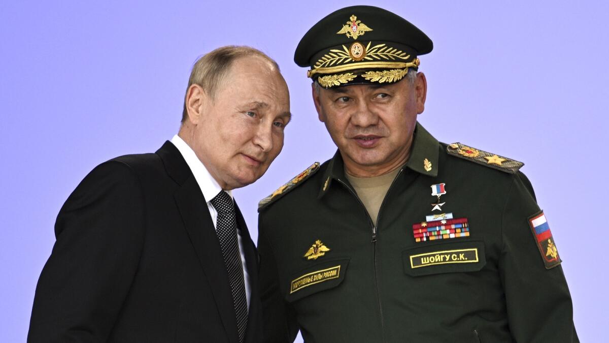 Russia's President Putin and Defence Minister Sergei Shoigu attend the opening of the Army 2022 International Military and Technical Forum in the Patriot Park outside Moscow on Monday. — AP