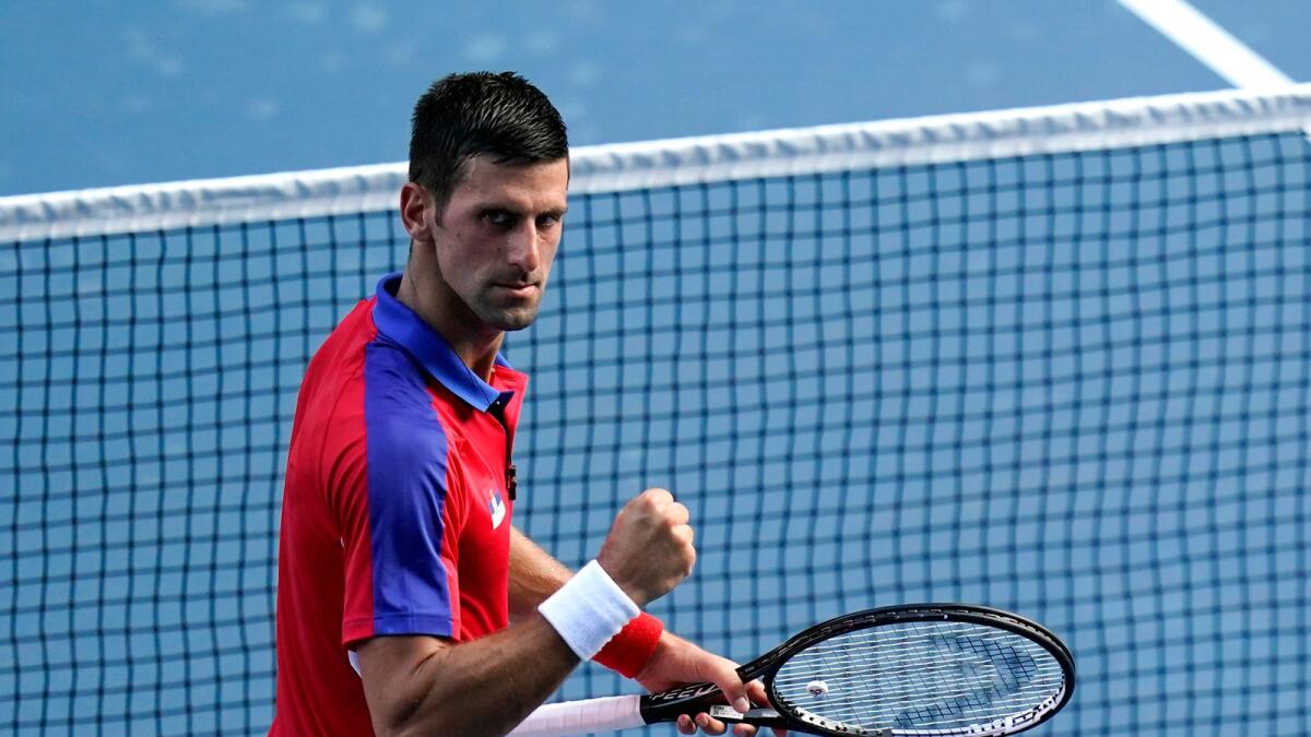 Novak Djokovic reacts after defeating Hugo Dellien, of Bolivia, during the tennis competition at the 2020 Summer Olympics. — AP