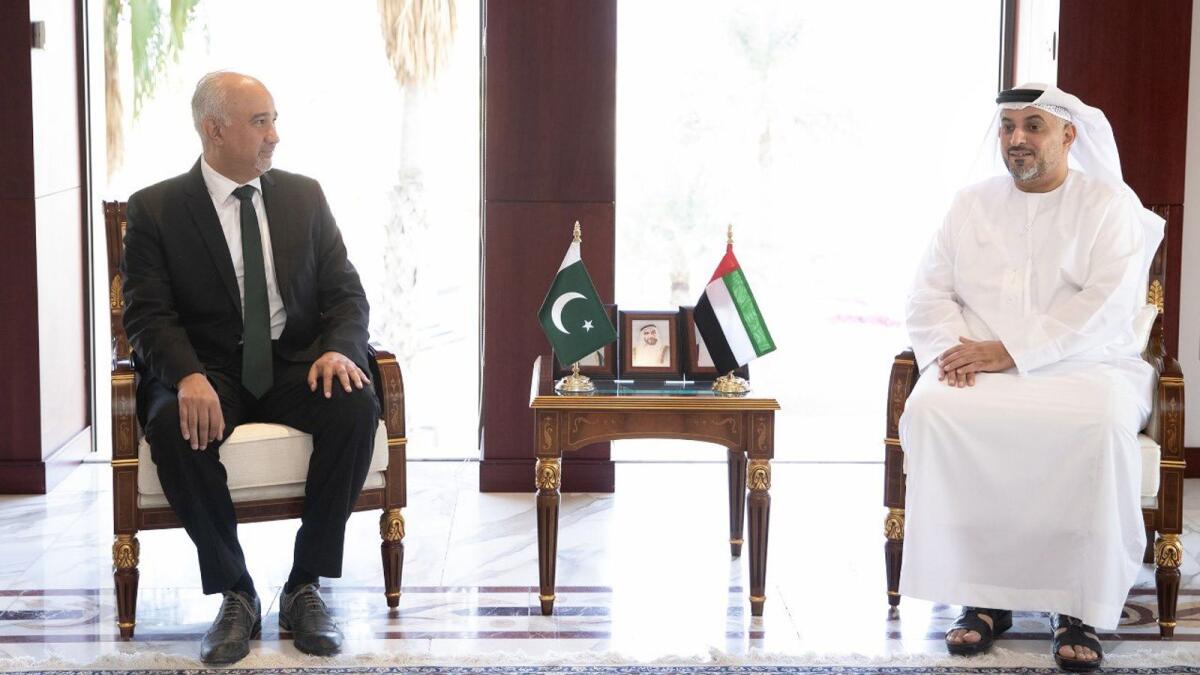 Pakistan Ambassador to the UAE Faisall Niaz Tirmizi and Mohamed Helal Al Mheiri, director-general of Abu Dhabi Chamber of Commerce and Industry, exchanging views of bilateral interest in Abu Dhabi on Wednesday. — Supplied photo 