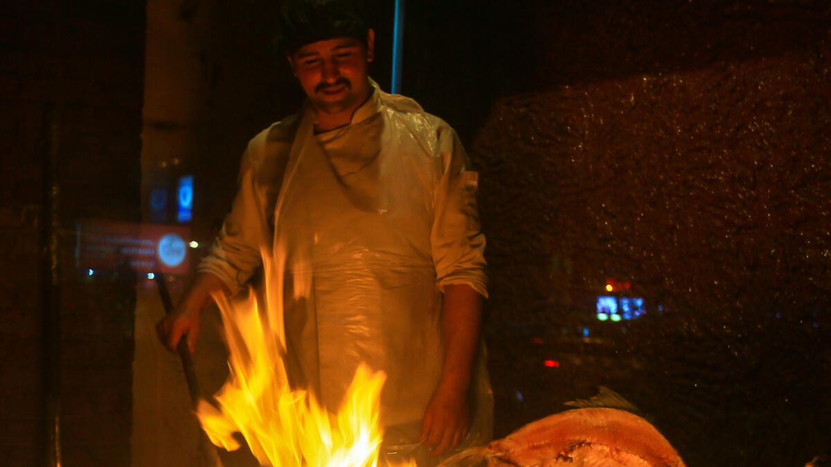Chef preparing the masquof at Samad Iraqi